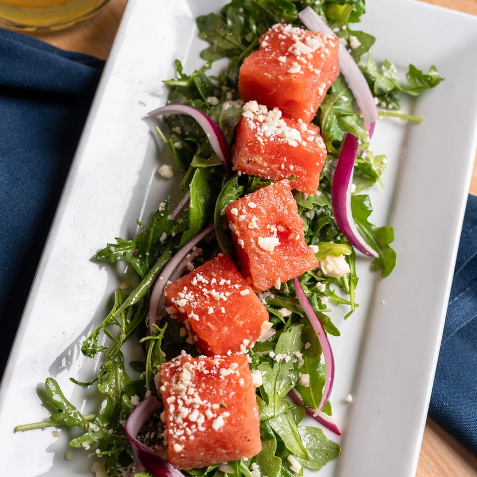 Watermelon and arugula salad with feta and red onion.
