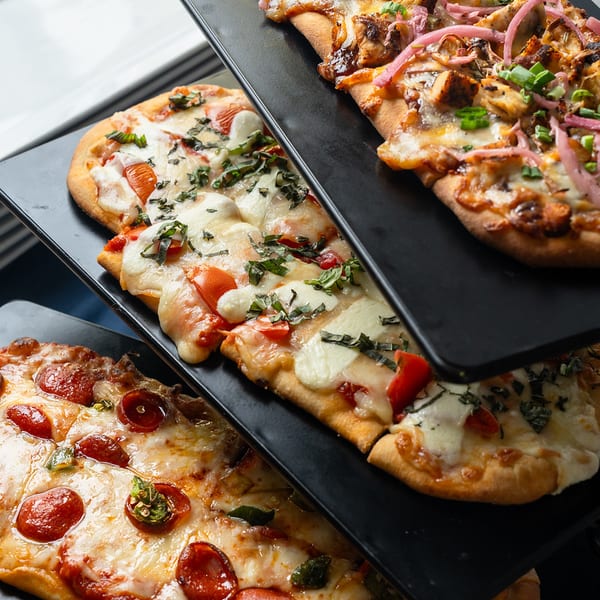 Trio of flatbreads on slate boards