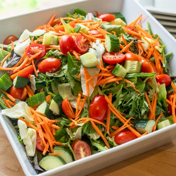 Fresh garden salad with cucumbers, tomatoes, and carrots